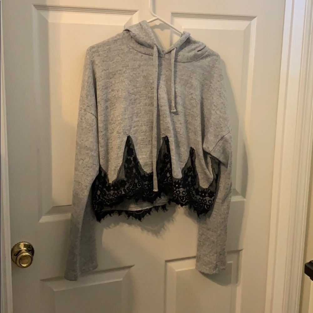 a grey and black hooded long sleeve crop tops